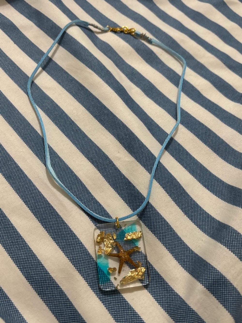 Hand Crafted Blue Cord Necklace with Gold Starfish Resin Pendant